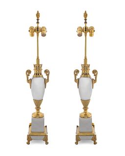 A Pair of Neoclassical Style Polished Steel and Gilt Metal Table Lamps
Height 35 1/2 inches.