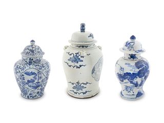 A Group of Three Chinese Blue and White Lidded Jars
Height of tallest 22 1/2 inches.