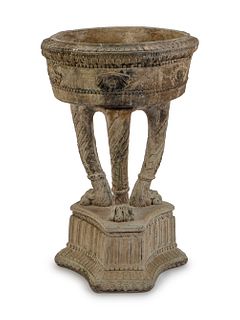 A Carved Stone Garden Jardiniere on a Tripartite Base
Height 30 1/4 x diameter 18 3/4 inches.