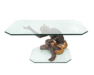 A Venetian Style Ebonized and Parcel Gilt Blackamoor Table
Height 20 inches.