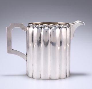 A WHITE-METAL MILK JUG
 maker T.J, stamped 33 and 