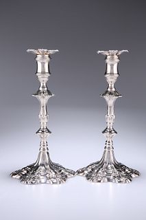 A PAIR OF GEORGE III CAST SILVER CANDLESTICKS
 by 