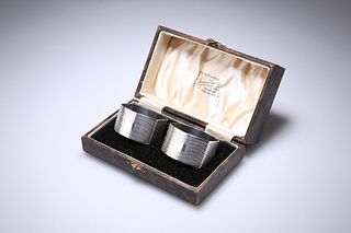A PAIR OF GEORGE V SILVER NAPKIN RINGS
 by Deakin 