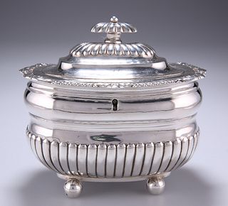 A GEORGE III SILVER TEA CADDY
 by J.W. Story and &