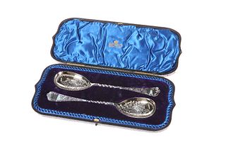 A PAIR OF LATE VICTORIAN SILVER SERVING SPOONS
 by