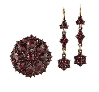 A GARNET-SET BROOCH AND EARRING SUITE
 The disc-sh