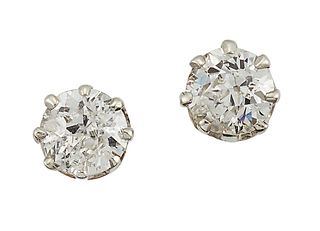 A PAIR OF DIAMOND STUD EARRINGS
 Each claw-set wit