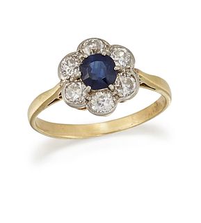 A SAPPHIRE AND DIAMOND CLUSTER RING
 The circular-