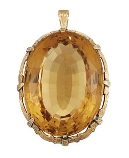 A CITRINE PENDANT
 The claw-set oval-cut citrine, 