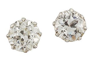 A PAIR OF DIAMOND STUD EARRINGS
 Each claw-set wit