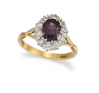 A PURPLE SAPPHIRE AND DIAMOND CLUSTER RING
 The ov