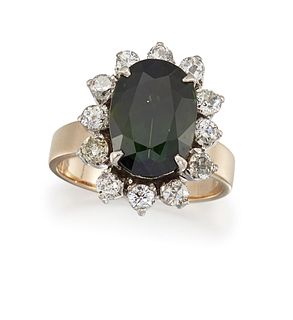 A GREEN SAPPHIRE AND DIAMOND CLUSTER RING
 The ova