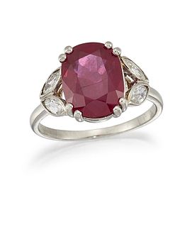 A RUBY AND DIAMOND RING
 The cushion-shaped ruby, 