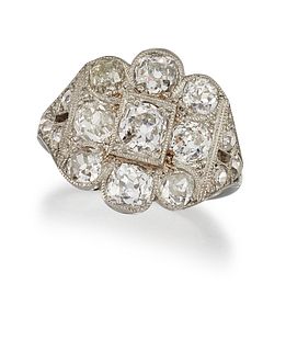 A DIAMOND CLUSTER RING
 The millegrain-accented cl