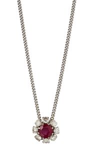 A RUBY AND DIAMOND PENDANT NECKLACE
 The circular-