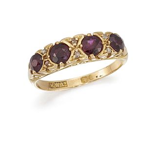 A RUBY AND DIAMOND FOUR-STONE RING
 Set with circu