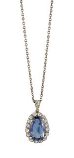 A SAPPHIRE AND WHITE TOPAZ PENDANT NECKLACE
 The p