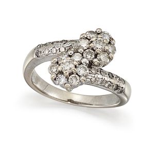 A DIAMOND CROSSOVER RING
 Designed as two clusters