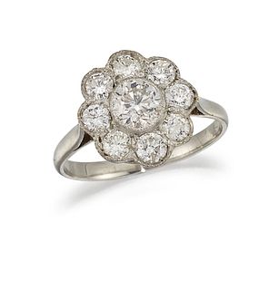 A DIAMOND CLUSTER RING
 Designed as a cluster of b