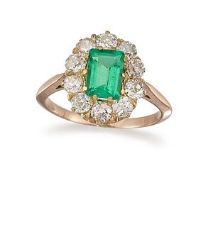 AN EMERALD AND DIAMOND CLUSTER RING 
 The octagona