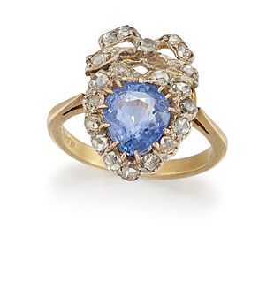 A SAPPHIRE AND DIAMOND RING
 The pear-shaped sapph