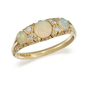 AN OPAL AND DIAMOND THREE-STONE RING
 Set with thr