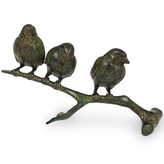 Bronze Birds Perched On a Branch