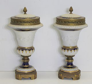 A Pair Of Signed Sevres Bronze Mounted Parian Urns