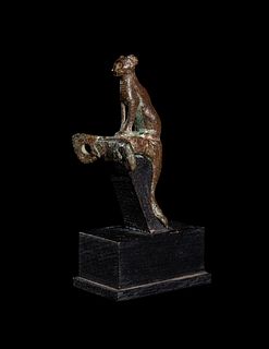 An Egyptian Bronze Handle with a Cat
Height 3 1/4 inches.