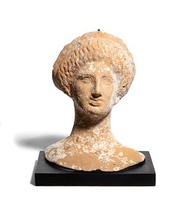 A Greek or Etruscan Terra Cotta Votive Head of a Woman 