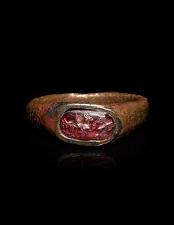 A Roman Bronze and Carnelian Finger Ring