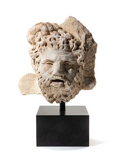 A Roman Marble Bearded Head, Perhaps a Giant, from a Relief