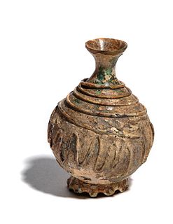 A Late Roman or Islamic Glass Bottle