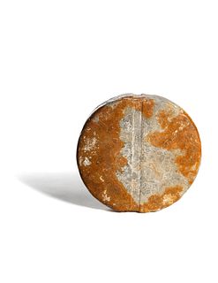 A Bactrian Mottled Green-Orange Stone Disk Ritual Object