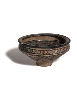 A Nishapur Pottery Bowl
Diameter 6 1/4 inches.
