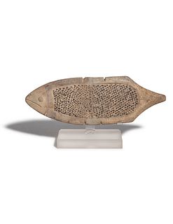 A La Tolita Pottery Grater in the Form of a Fish
Width 10 5/8 inches.