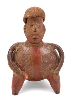 A Jalisco Pottery Figure
Height 11 1/4 inches.