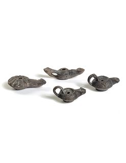 Four Roman Molded Terra Cotta Oil Lamps
Width 4 1/4 inches.