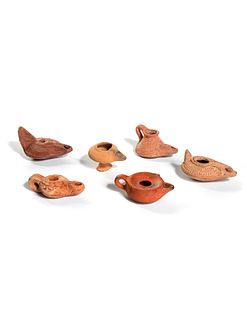 Six Roman Molded Terra Cotta Oil Lamps
Width of first 3 1/2 inches.