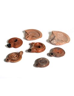 Five Roman Molded Terra Cotta Oil Lamps
Width of widest 4 1/4 inches.
