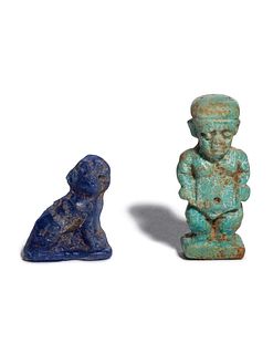 An Egyptian Glass Anubis Amulet and an Egyptian Faience Pataikos Amulet