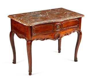 A Louis XV Provincial Carved Walnut Table
Height 30 x length 39 1/2 x depth 22 inches.