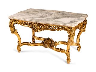 A Louis XV Style Pierce-Carved Giltwood Salon Table
Height 30 x length 33 x depth 34 1/2 inches.
