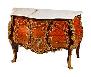 A Louis XV Style Gilt-Bronze-Mounted Parquetry Commode
Height 34 1/2 x length 51 x depth 23 inches.
