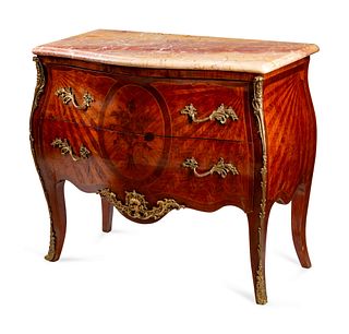 A Louis XV Style Gilt-Bronze-Mounted Marquetry Commode
Height 35 1/2 x length 40 1/2 x depth 20 inches.