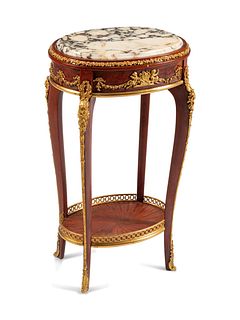 A Louis XV Style Gilt-Bronze-Mounted Stand
Height 31 x width 17 1/2 x depth 13 inches.