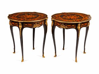 A Pair of Louis XV Style Gilt-Bronze-Mounted Marquetry Tables de Milieu
Height 30 x diameter 28 inches.