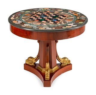 An Empire Style Parcel-Gilt Mahogany and Specimen Marble Center Table
Height 29 1/2 x diameter 36 inches.