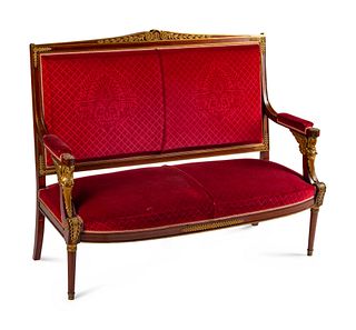 An Empire Style Gilt-Bronze-Mounted Mahogany Settee
Height 45 x length 54 x depth 21 inches.