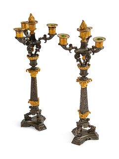 A Pair of Empire Parcel-Gilt and Patinated Bronze Four-Light Candelabra
Height 19 1/2 x width 7 1/2 x depth 7 1/2 inches.